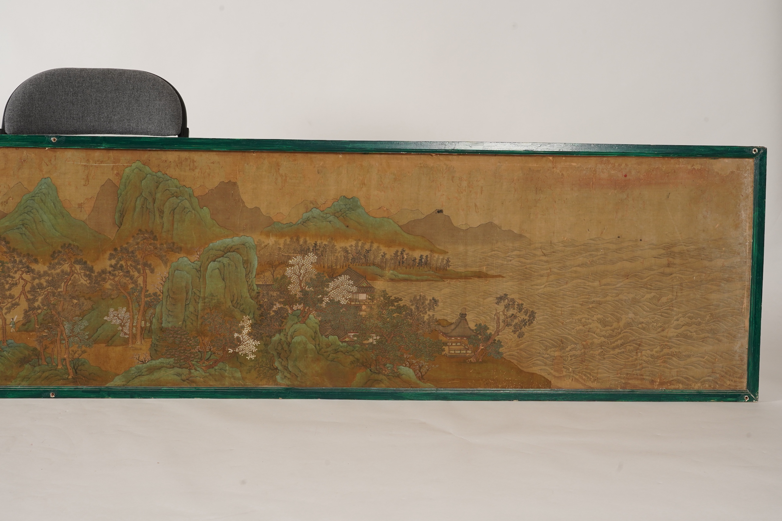 Chinese School , 17th century or earlier, Scholars in a mountainous river landscape scene with pavilions, Ink and colour on silk, incomplete clerical script signature, 54cm x 290cm